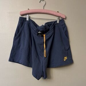 Nike Women's Blue Athletic Shorts with Yellow Accents